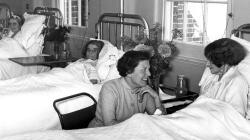 Black and white photo of Visitors and patients, around the year 1956.