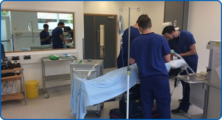 Clinicians carrying out a scenario using a manikin in the Sim Space at Southmead Hospital