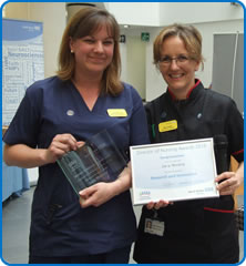 Lucy Mooney receives her award from Director of Nursing Sue Jones at Nurses Day 2016 awards Lucy Mooney receives her award from Director of Nursing Sue Jones at Nurses Day 2016 awards