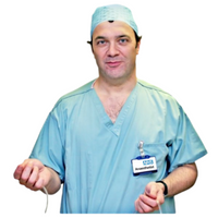 Anaesthetist in light blue uniform wearing a theatre hat