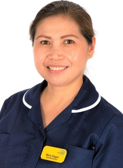 Mary Ilagan, Band 7 Senior Sister and Internationally Educated Nurse at NBT, photographed in uniform on a white background.
