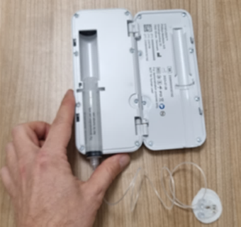 Open Produodopa pump held open with hand