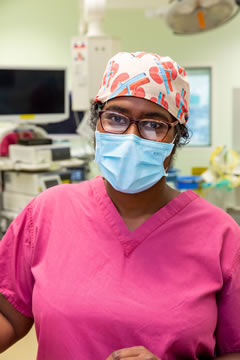 Transplant Consultant in scrubs and mask