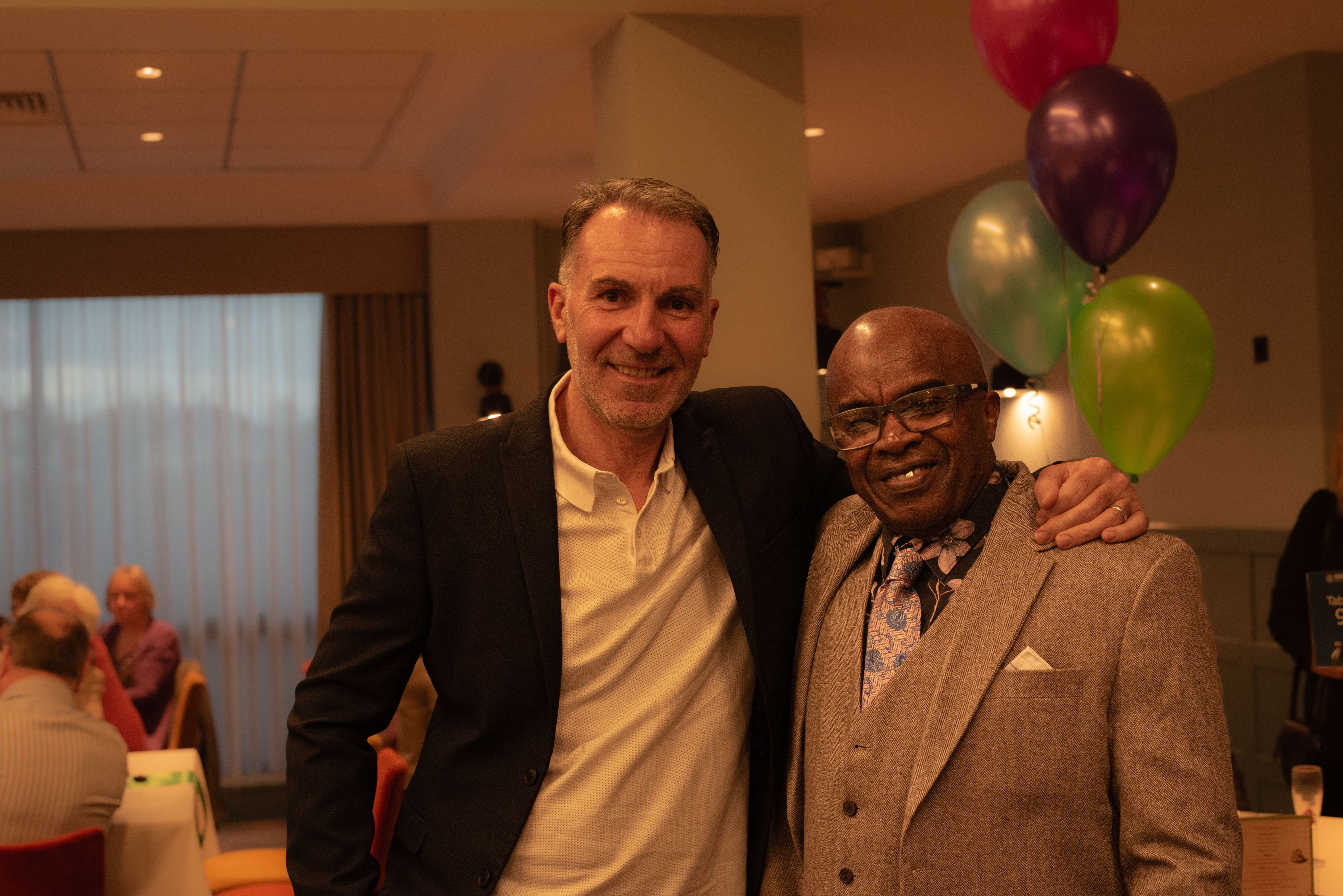 Two people at the volunteers event looking at the camera