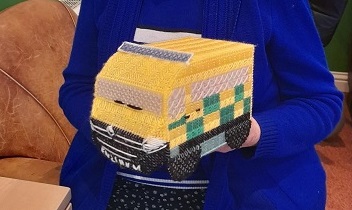 An ambulance shape knitted tissue box holder