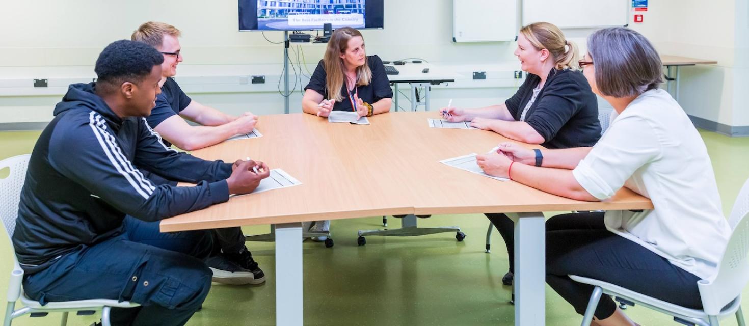 Assessment centre - people sitting around a table