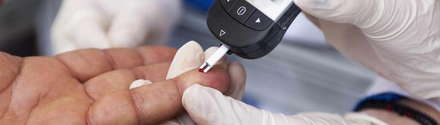 Patient receiving a blood glucose test