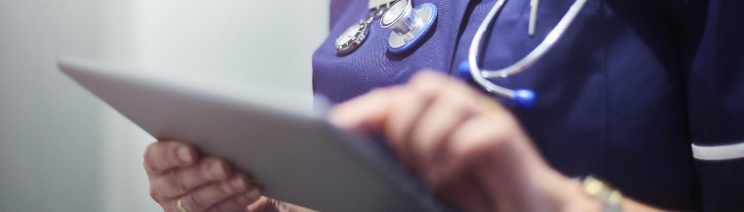 Nurse collecting data with an iPad