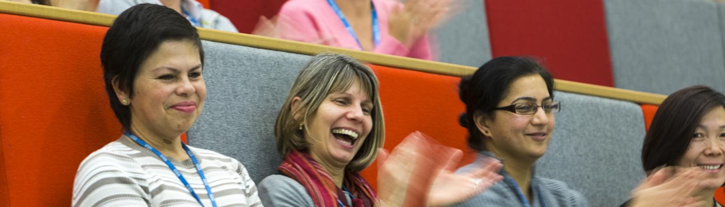 Staff applause during a lecture