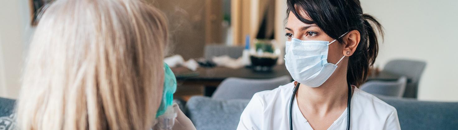 Nurse tending to a patient