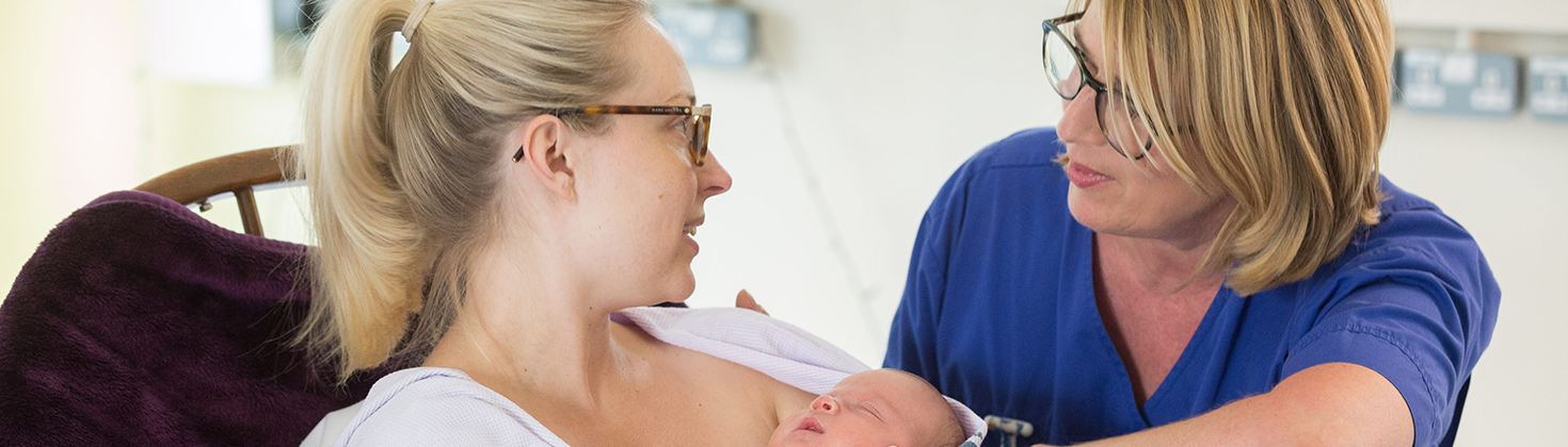 Maternity nurse with patient & baby