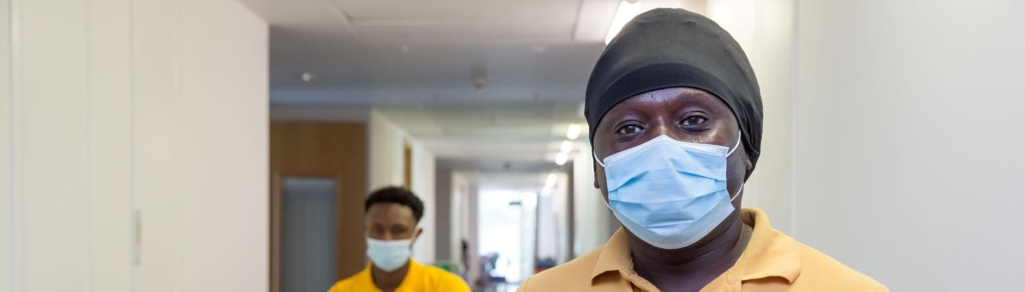 Two members of staff with masks on 