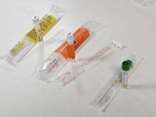 Container: Aptima Tubes - sample type specific and separate COPAN swab