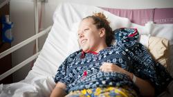 Patient Ellie Lane enjoys the sounds of music on her ward - Image Clint Randall.