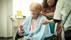A patient receives an origami bird as a gift - Image Clint Randall.