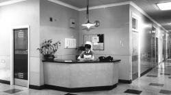 Black and white photo of Nurse duty station, around the year 1963.