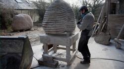 Picture of Peter Randall carving with air tool in March 2013