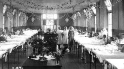 Black and white photo of A Matrons Christmas tea party, around the year 1925.