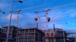 Camera photo of 2 balloons over the building work. Taken during the balloon fiesta August 2011. Submitted by Charlie Tomson.