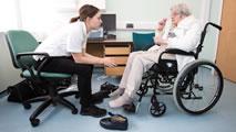 Doctor helping patient with orthotics