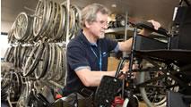 Man repairing a wheelchair