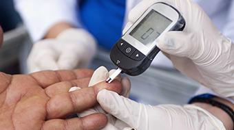 Patient receiving a blood glucose test