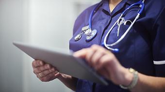 Nurse collecting data with an iPad