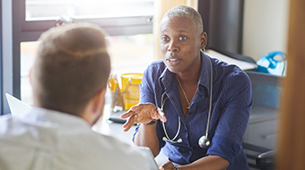 Doctor talking to patient