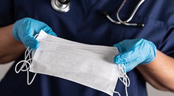 Nurse holding a face mask