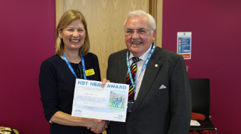 Andrea Young (Chief Executive) handing out an NBT Hero Award certificate Andrea Young (Chief Executive) handing out an NBT Hero Award certificate