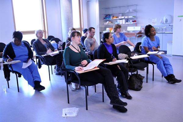 Apprentices sitting down in a classroom