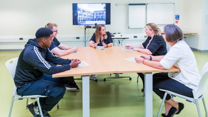 Assessment centre - people sitting around a table