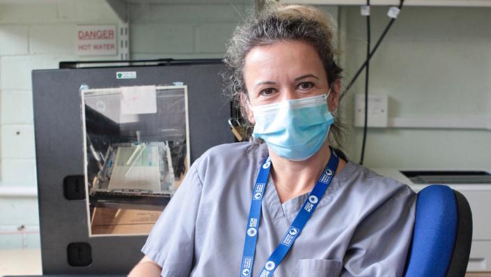 Nurse Associate with mask on smiling at camera