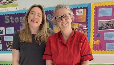 Dr Lisa Kirk and matron Maggie Smith at Patchway Children's Centre Two people stand together smiling, one in a red matron tunic