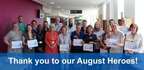 Image of a group of staff members holding certificates Image of a group of staff members holding certificates