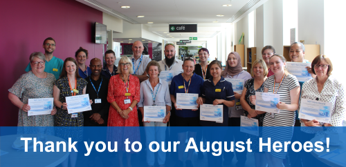 Image of a group of staff members holding certificates 