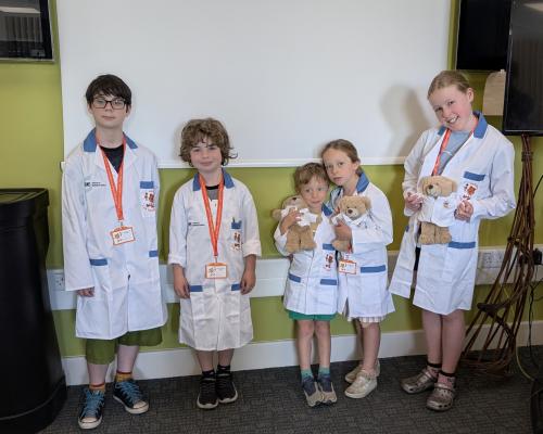 Group photo of five children on a Harvey's Lab Tour