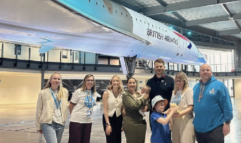 A group of people stood next to Concorde