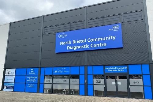 A building with a blue sign reading "North Bristol Community Diagnostic Centre"