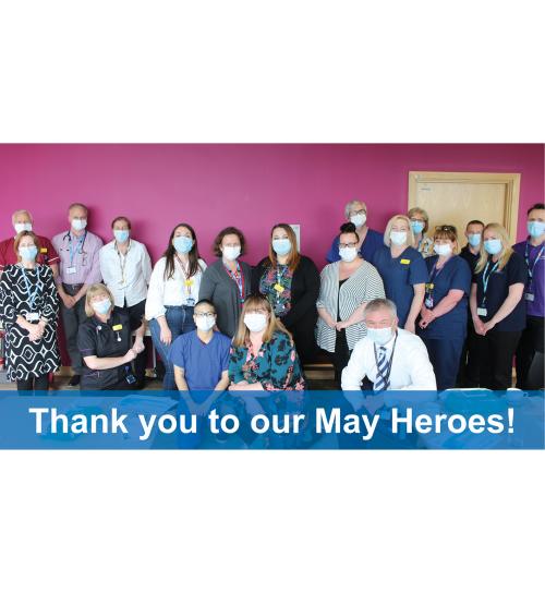 Image of members of staff posed for a photo with blue banner along the bottom which reads "Thank you to our May Heroes!"