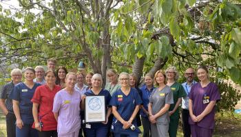 NICU team with their Baby Friendly Initiative plaque