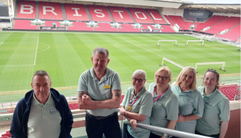 The health checks team standing in front of the pitch at Ashton Gate 