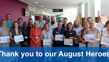 Image of a group of staff members holding certificates 