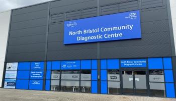 A building with a blue sign reading "North Bristol Community Diagnostic Centre"