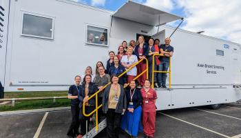 A group of around 20 NBT staff members stood outside the new mobile screening unit at Southmead Hospital