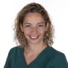 Head and shoulders photo of Obstetric Physician Lead Francesca Neuberger wearing dark green scrubs
